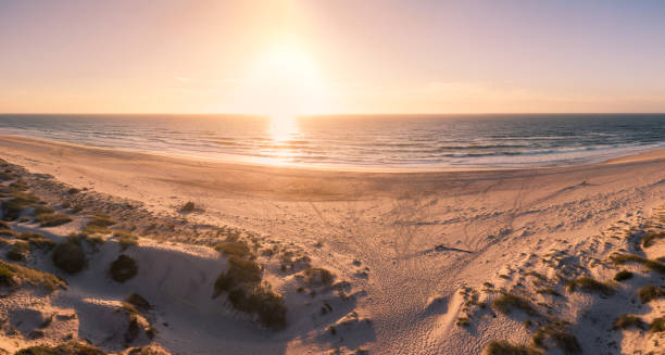 istock Aerial view of beach at sunset 887292122