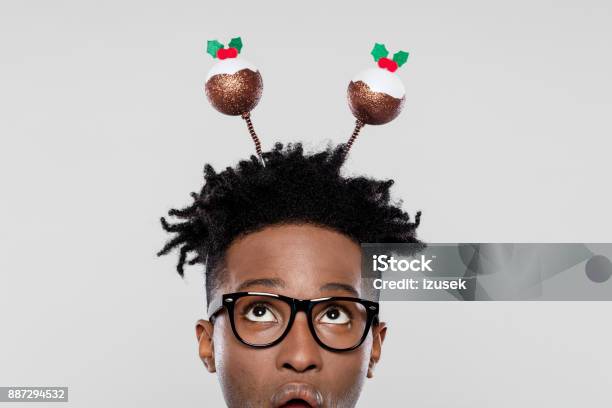 Funny Portrait Of Surprised Nerdy Man Wearing Christmas Headband Stock Photo - Download Image Now