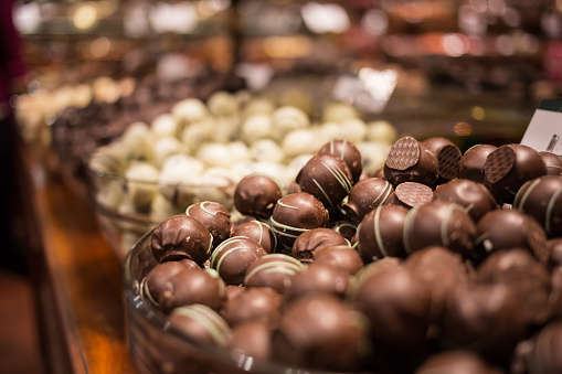 Belgium tasty truffle delicious chocolate in a row, candy shop view. Food travel tourism
