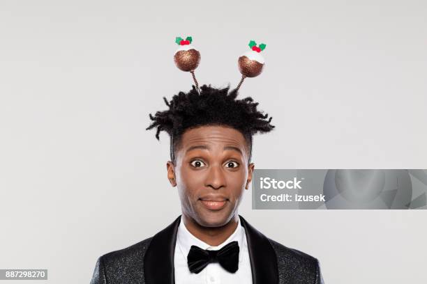 Funny Portrait Of Surprised Elegant Man Wearing Christmas Headband Stock Photo - Download Image Now