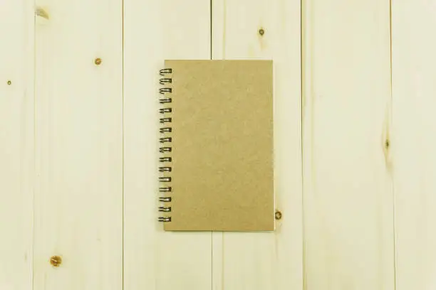 Notebook on wood background