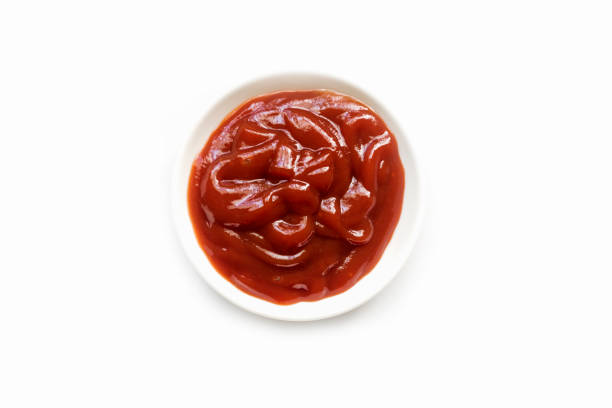 istock Tomato Sauce in White Cup Isolated with white background 887301636