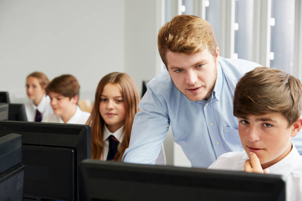 istock Teenage Students Wearing Uniform Studying In IT Class 887302442