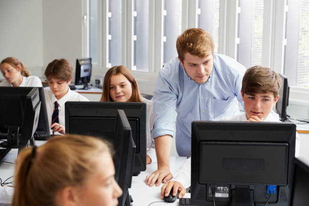 istock Teenage Students Wearing Uniform Studying In IT Class 887302482