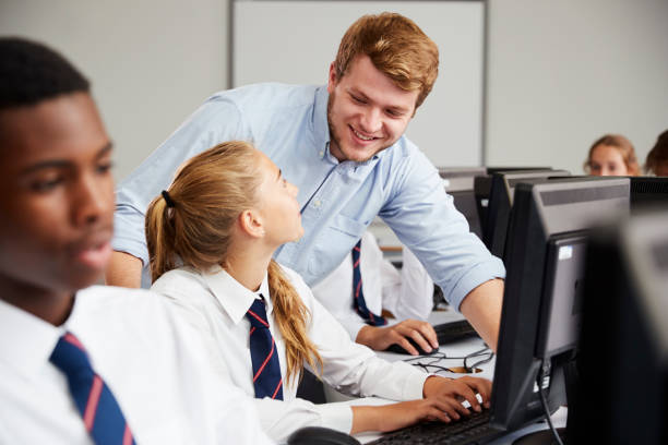 istock Teenage Students Wearing Uniform Studying In IT Class 887302486