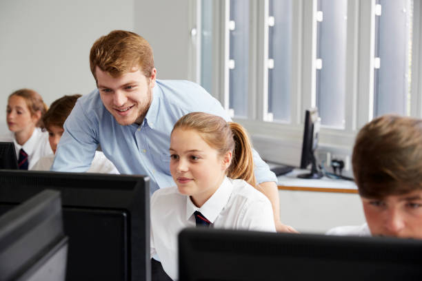 istock Teenage Students Wearing Uniform Studying In IT Class 887302544
