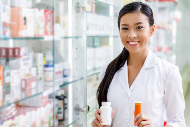 istock pharmacist with medication in drugstore 887303324