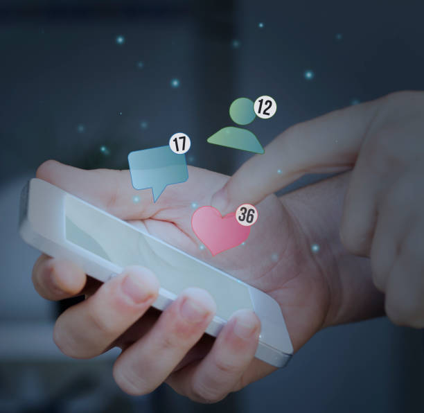 istock hand touching smartphone. social stats concept. 887307358