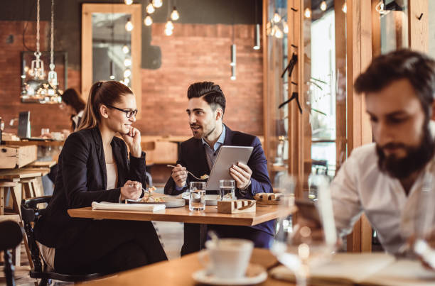 istock Business People Discussing Work at Cafe Restaurant 887307448