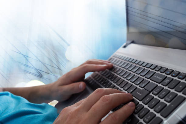 istock Man's hands typing on laptop notebook keyboard in the office. Man browsing information on internet. Freelance blogging, it support concept 887307468