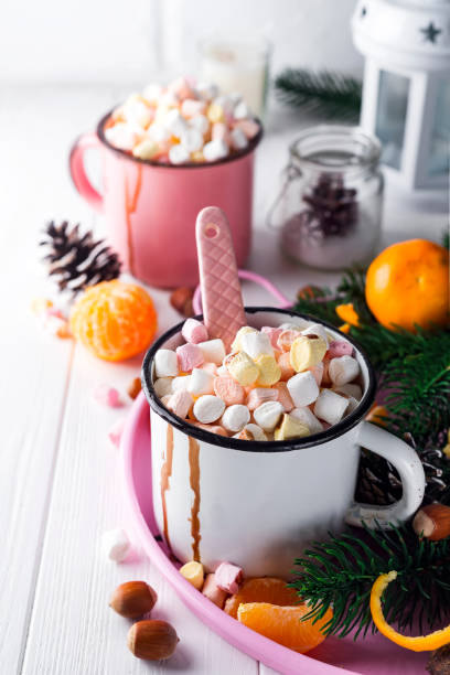 istock two cups with hot chocolate or cocoa with melted marshmallow 887307686