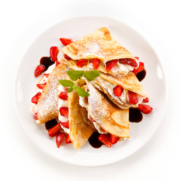 istock Crepes with strawberries and cream 887312274