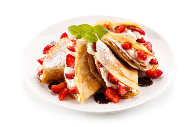 istock Crepes with strawberries and cream 887312348