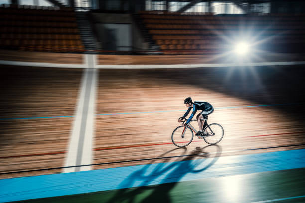 Athlete on a bicycle on velodrome