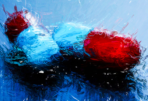 A digitally generated illustration of Pills medicine capsules blue and red