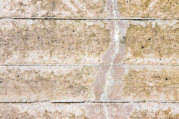istock Damaged reinforced concrete wall with cracks 887322020