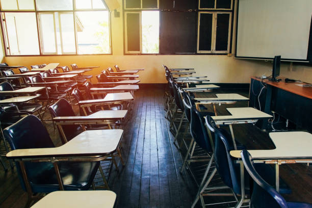 istock Classroom in background without ,No student or teacher . with Sunset limelight  near window. 887325406
