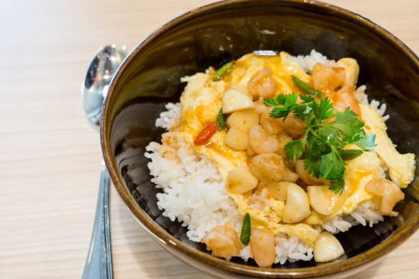 istock Fried rice with basil shrimp and egg. Selective focus shrimp, Popular thai food 887329814