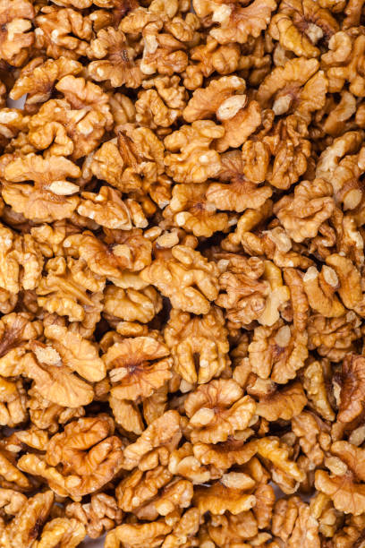 istock Pile of whole walnut 887330386