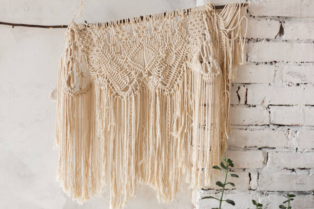 istock Loft interior white wall background, brick texture with knitted decor shawl 887330712