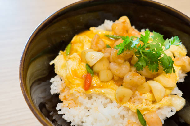istock Fried rice with basil shrimp and egg. Selective focus shrimp, Popular thai food 887336754