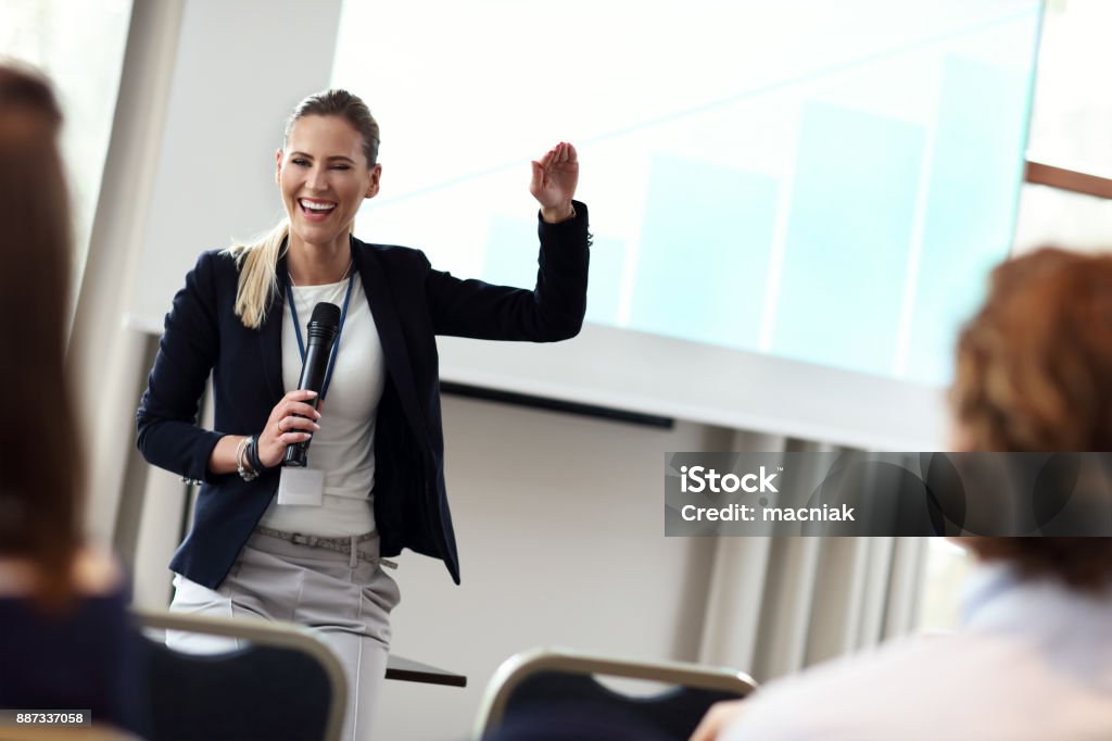 Business people having a conference Picture showing business people having a conference Public Speaker Stock Photo