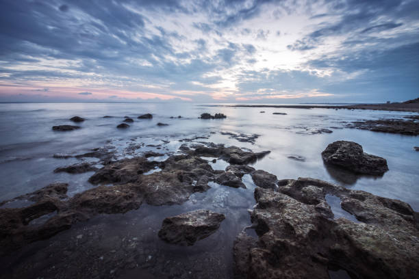 istock Reflections.Magnificent long exposure sea sunset landscape. 887337176