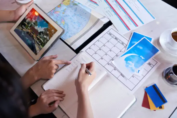 Photo of Loving Couple Planning Vacation Trip