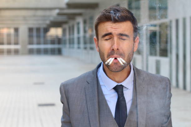 istock Stressed out businessman smoking and crying 887337780
