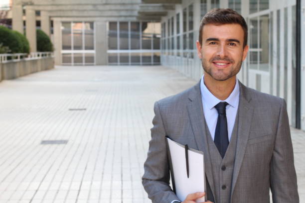 istock Confident handsome young businessman close up 887340016
