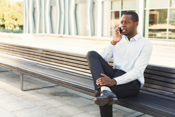 istock Black businessman outdoors in smart casual ware 887346320