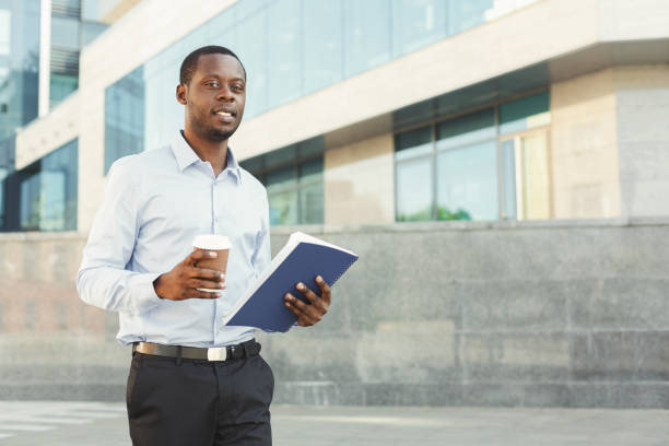 istock Portrait of a confident young black businessman with notepad 887347404