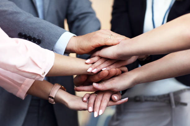 istock Business people joining hands 887350398