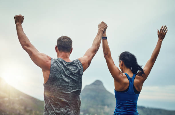 We can do anything with each other by our side Shot of an unrecognizable couple training for a marathon outdoors two winners stock pictures, royalty-free photos & images