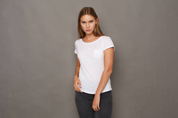 istock Cheerful girl in casual clothes posing at studio 887354170