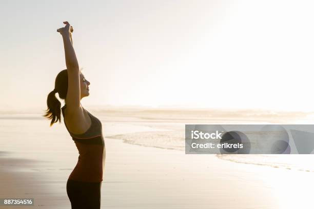 Exercise At The Beach Stock Photo - Download Image Now - Wellbeing, Women, Healthy Lifestyle