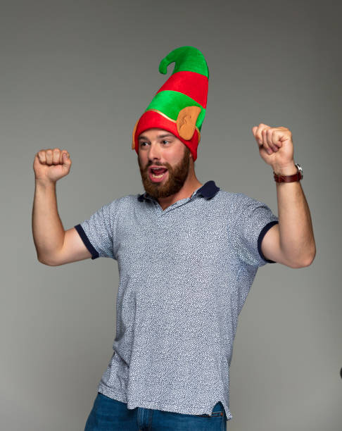 istock Happy bearded guy with Christmas Elf hat 887357800