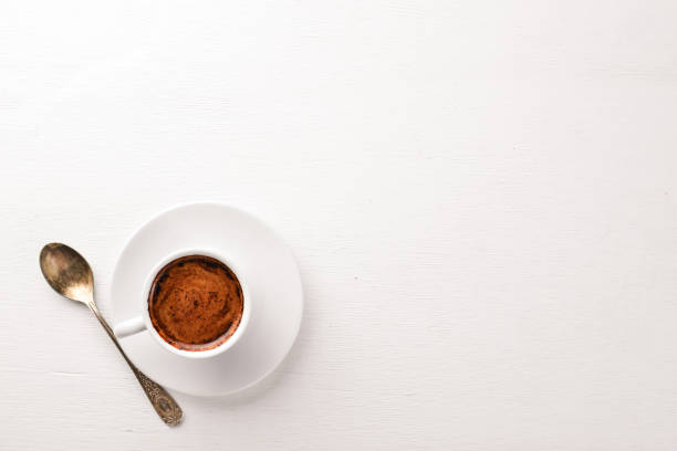 istock Espresso coffee cup on a white wooden background. Top view. Free space for text. 887358620