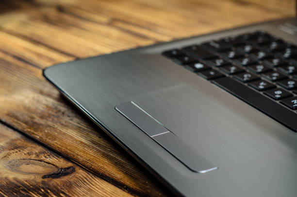 istock Laptop on wooden table 887360884