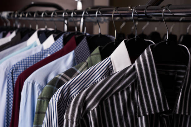 istock Mens shirts in different colors on hangers 887362950
