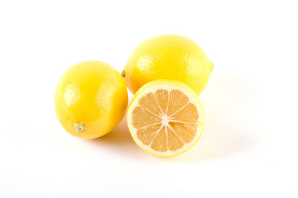 istock Lemons with leaves on a white background. Fresh lemons on a white background. 887365512