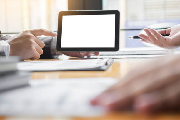 istock Business People Discussing In Meeting Over Digital Tablet At Office 887366244