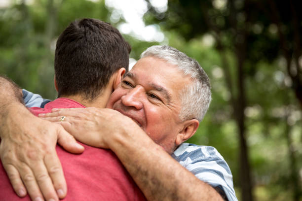 istock Adult son hugging his senior dad 887366812