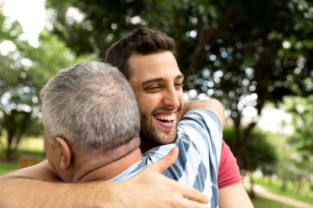 istock Adult son hugging his senior dad 887366882