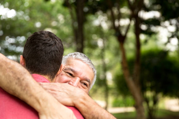 istock Adult son hugging his senior dad 887366908