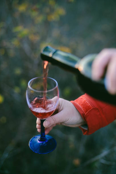 istock Red wine pouring into glass Red wine pouring into glass 887373354