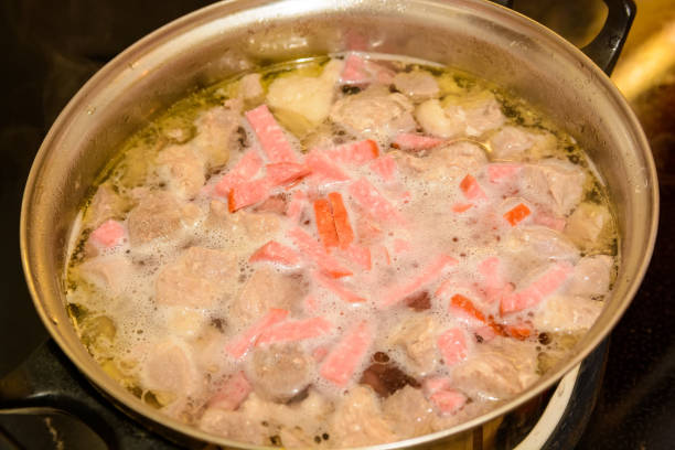 istock Sausage soup in pan 887386330