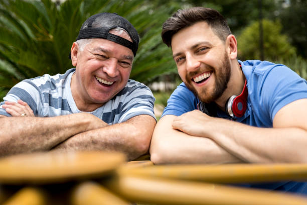 istock Dad and son having fun in the park 887390974