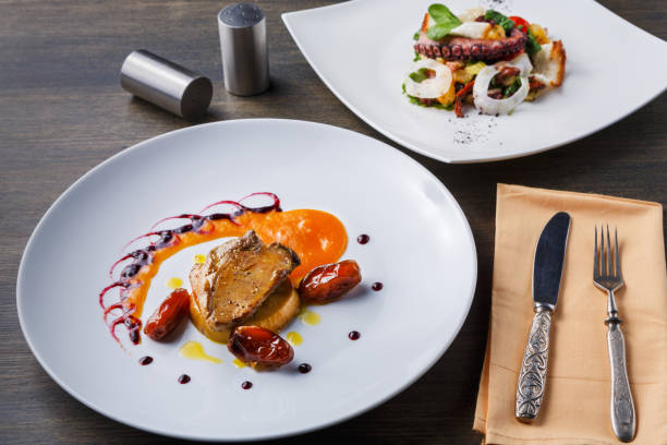istock Roasted goose liver with date fruit and apple 887395350