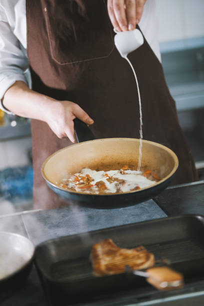 istock Pouring the sauce into the meat 887395470